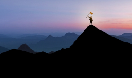 silhouette businessman standing mountain top sunset twilight background with flag winner success leadership concept